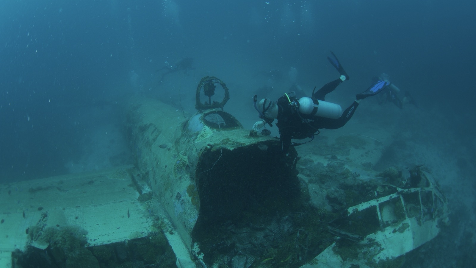 A lone diver exploring an aircraft wreck