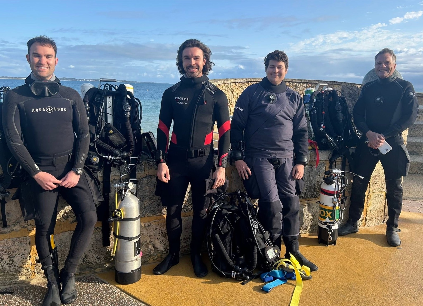 Technical divers with their stage cylinders after a training dive