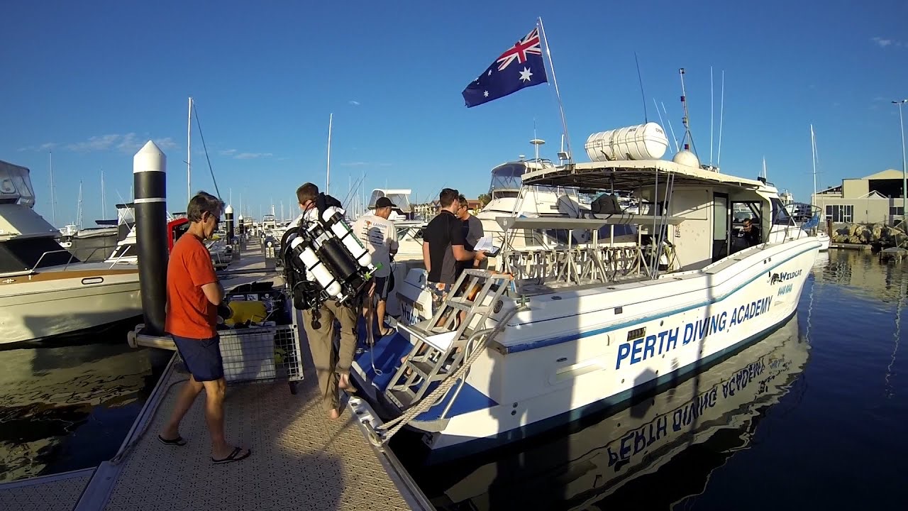Divers boarding Perth Diving Academy's dive boat Wildcat at the marina